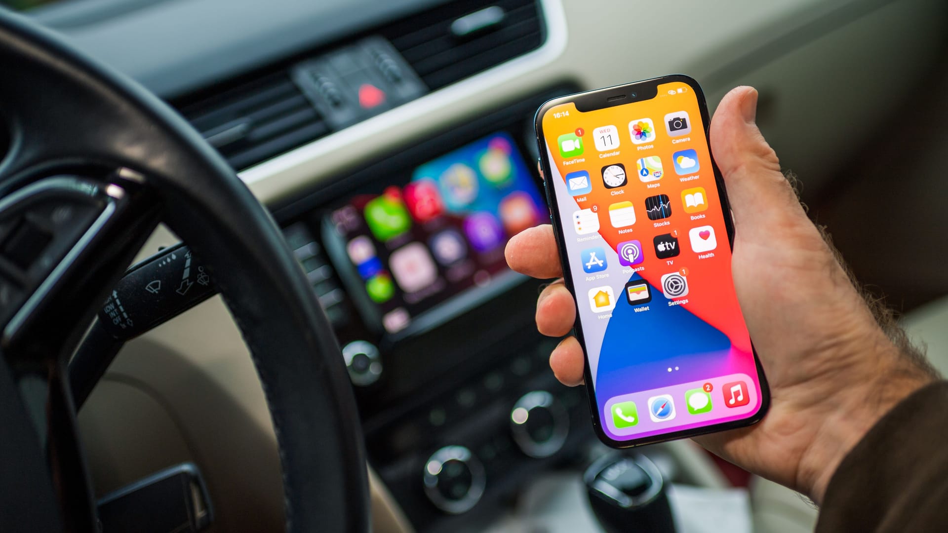 Apple Computers CarPlay from iOS iphone device inside car dashboard