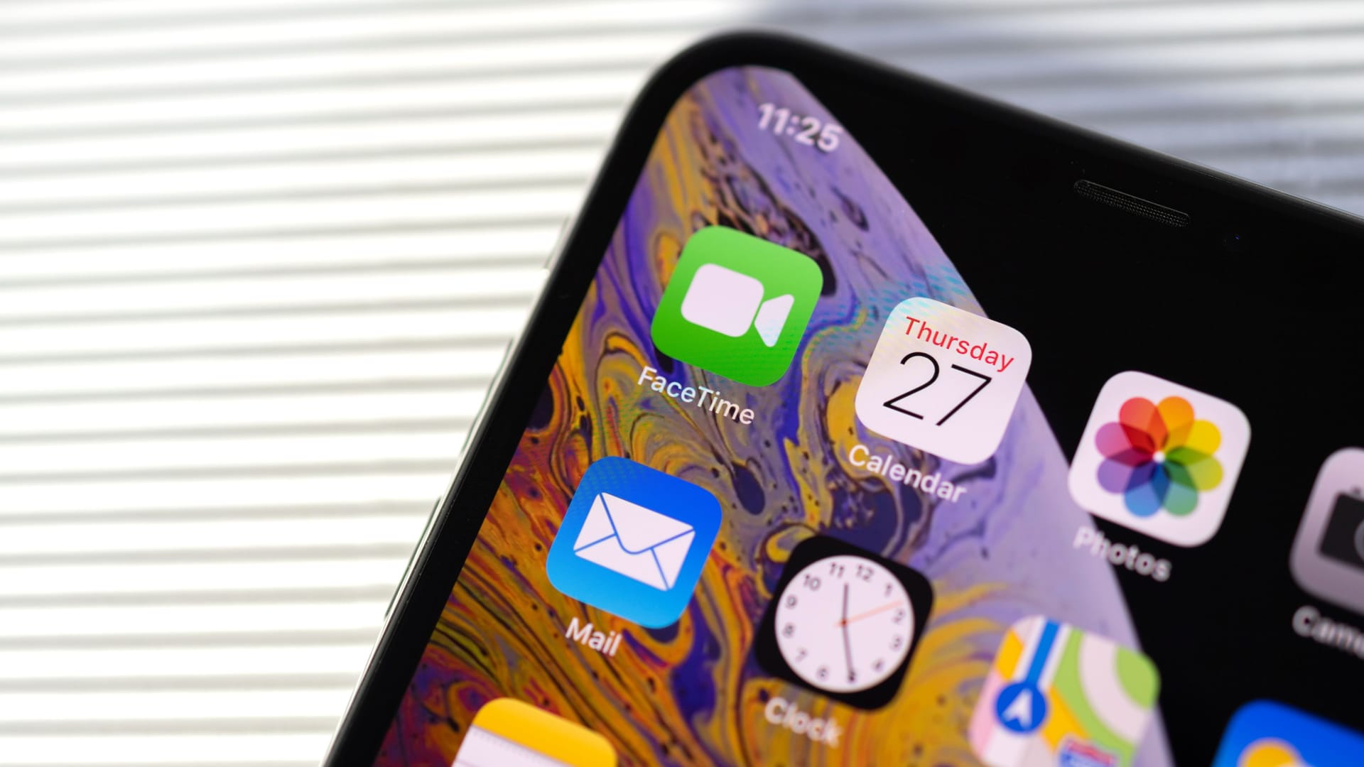 New iphone Xs Max with all home apps white background,