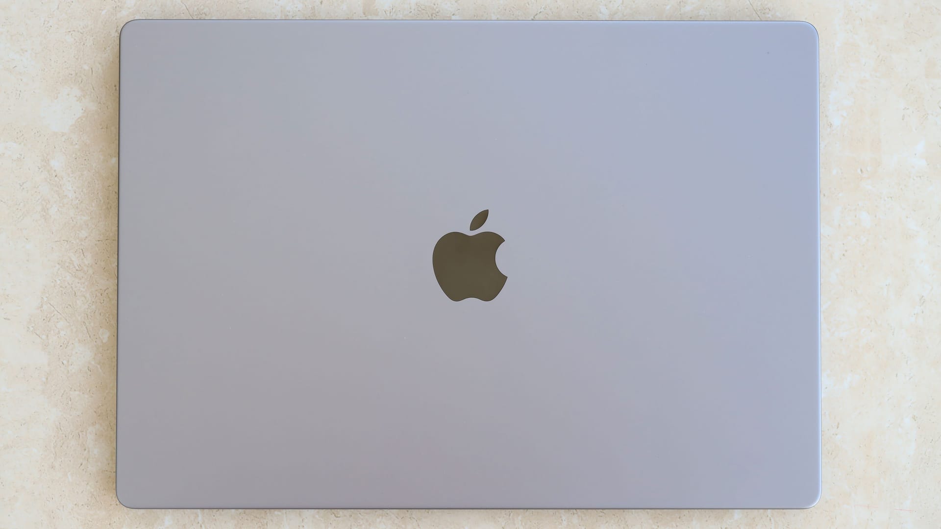 KYIV, UKRAINE - 4 MAY, 2023: Cover view of MacBook Air MacBook Pro 13 in space gray color isolated on white background